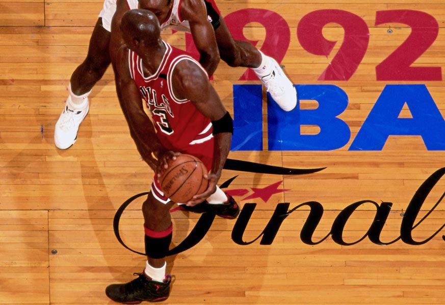 michael jordan standing on top of court logo